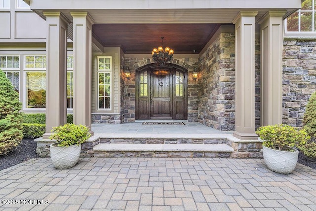 23 Pilgrim Way, Colts Neck, NJ 07722 - doorway to property with stone siding and a porch