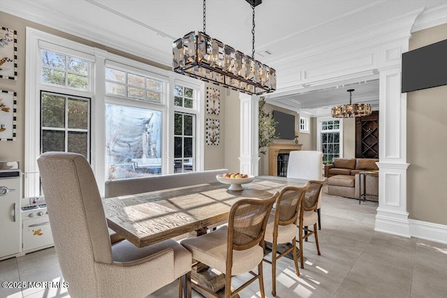 23 Pilgrim Way, Colts Neck, NJ 07722 - dining room with ornate columns, ornamental molding, a chandelier, light tile patterned floors, and baseboards