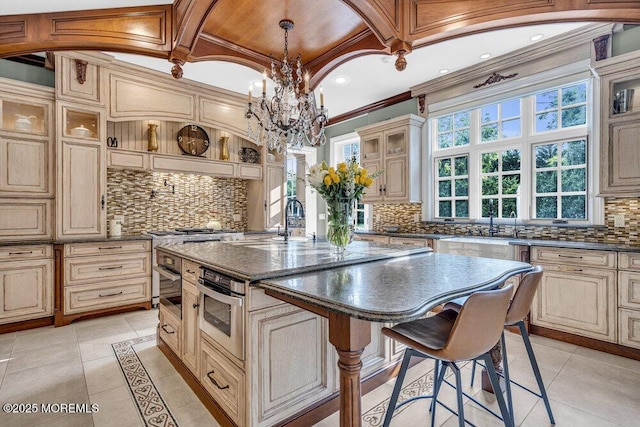 23 Pilgrim Way, Colts Neck, NJ 07722 - kitchen with cream cabinets, decorative backsplash, a chandelier, ornamental molding, and recessed lighting