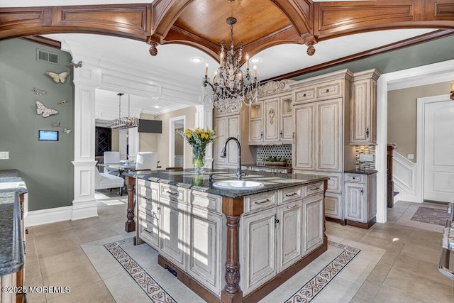 23 Pilgrim Way, Colts Neck, NJ 07722 - kitchen featuring a chandelier, cream cabinetry, dark stone counters, light tile patterned flooring, and crown molding