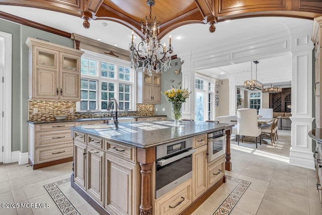 23 Pilgrim Way, Colts Neck, NJ 07722 - kitchen featuring inlaid floor details, a chandelier, a sink, crown molding, and backsplash