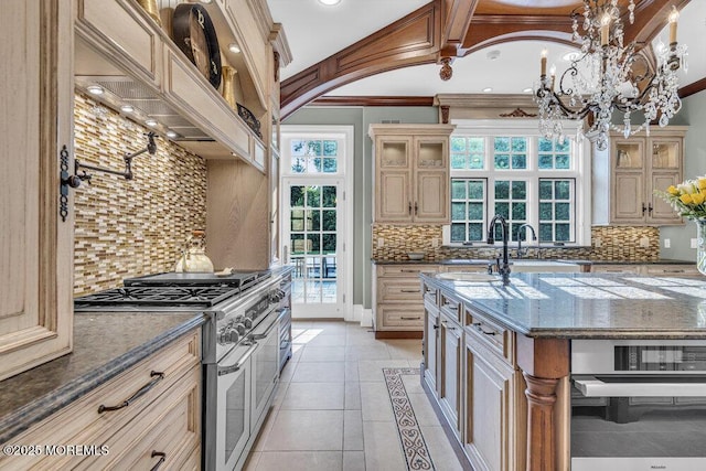 23 Pilgrim Way, Colts Neck, NJ 07722 - kitchen with stainless steel appliances, a chandelier, backsplash, cream cabinets, and ornamental molding