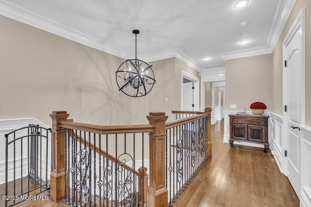 23 Pilgrim Way, Colts Neck, NJ 07722 - corridor with an upstairs landing, a chandelier, wood finished floors, crown molding, and recessed lighting