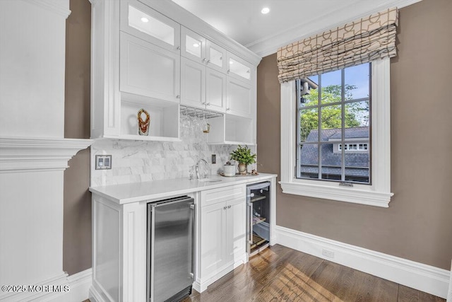 23 Pilgrim Way, Colts Neck, NJ 07722 - indoor wet bar featuring beverage cooler, tasteful backsplash, baseboards, dark wood finished floors, and recessed lighting