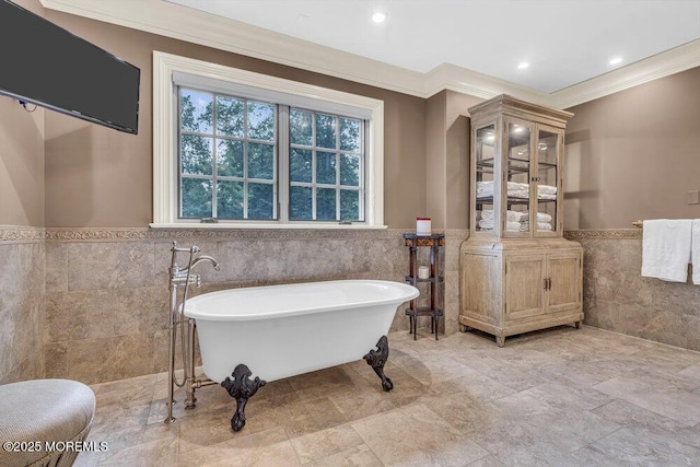 23 Pilgrim Way, Colts Neck, NJ 07722 - bathroom with tile walls, a wainscoted wall, ornamental molding, a freestanding tub, and recessed lighting