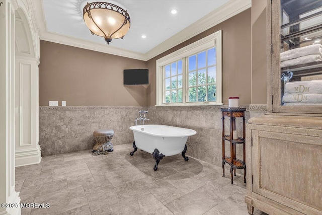 23 Pilgrim Way, Colts Neck, NJ 07722 - bathroom with tile walls, ornamental molding, a freestanding tub, a wainscoted wall, and recessed lighting