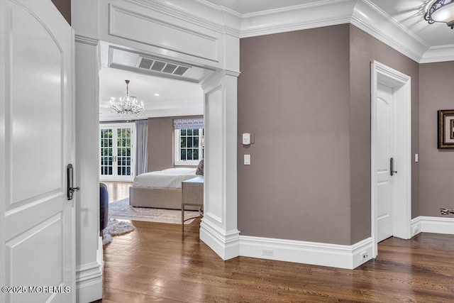 23 Pilgrim Way, Colts Neck, NJ 07722 - hallway featuring dark wood-style flooring, crown molding, a chandelier, and baseboards