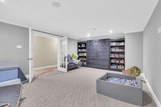 23 Pilgrim Way, Colts Neck, NJ 07722 - playroom with ornamental molding, light colored carpet, french doors, baseboards, and recessed lighting