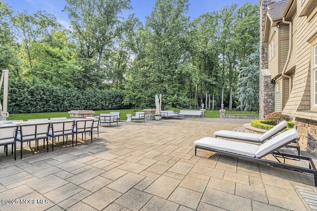 23 Pilgrim Way, Colts Neck, NJ 07722 - view of patio / terrace with outdoor dining space and view of scattered trees