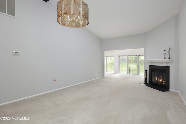 40 Smoke Tree Ter Unit 142, Red Bank, NJ 07701 - unfurnished living room with a chandelier, carpet floors, a fireplace with flush hearth, and high vaulted ceiling
