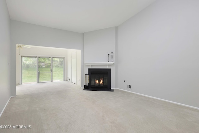 40 Smoke Tree Ter Unit 142, Red Bank, NJ 07701 - unfurnished living room featuring a fireplace with flush hearth, carpet flooring, and ceiling fan