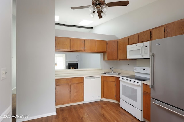40 Smoke Tree Ter Unit 142, Red Bank, NJ 07701 - kitchen with white appliances, a ceiling fan, wood finished floors, light countertops, and vaulted ceiling