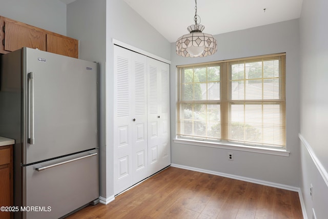 40 Smoke Tree Ter Unit 142, Red Bank, NJ 07701 - unfurnished dining area with light wood-style floors and lofted ceiling