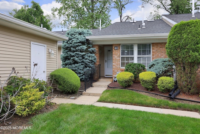 40 Smoke Tree Ter Unit 142, Red Bank, NJ 07701 - view of front facade featuring a shingled roof