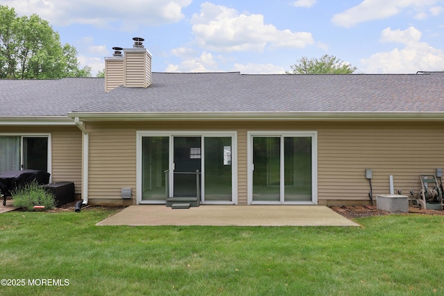 40 Smoke Tree Ter Unit 142, Red Bank, NJ 07701 - rear view of house featuring a yard, a patio, a chimney, and a shingled roof