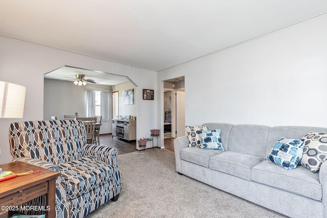 164 Holly St, Port Reading, NJ 07064 - carpeted living room with a ceiling fan and arched walkways