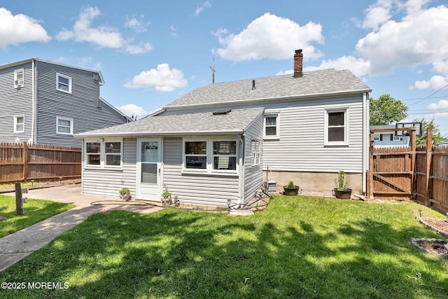 164 Holly St, Port Reading, NJ 07064 - back of property with a chimney and roof with shingles