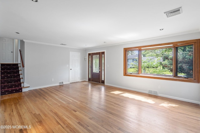 2005 Nassau Dr, Spring Lake, NJ 07762 - unfurnished living room with light wood finished floors, stairs, and ornamental molding