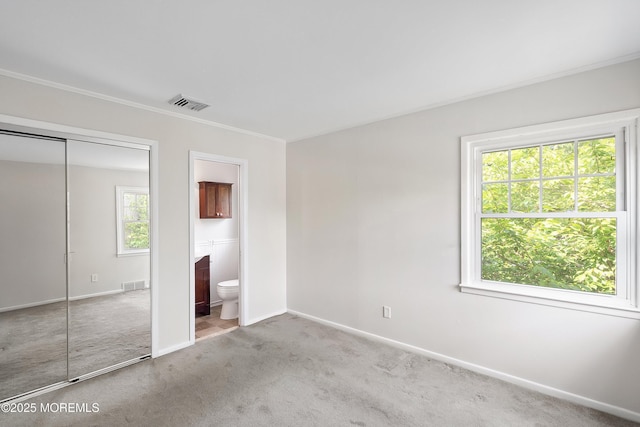 2005 Nassau Dr, Spring Lake, NJ 07762 - unfurnished bedroom with carpet flooring, connected bathroom, a closet, and ornamental molding