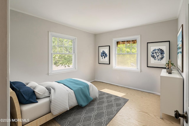 2005 Nassau Dr, Spring Lake, NJ 07762 - bedroom featuring multiple windows, crown molding, and light wood finished floors