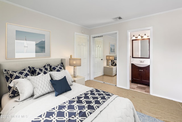2005 Nassau Dr, Spring Lake, NJ 07762 - bedroom with crown molding, a closet, and ensuite bathroom