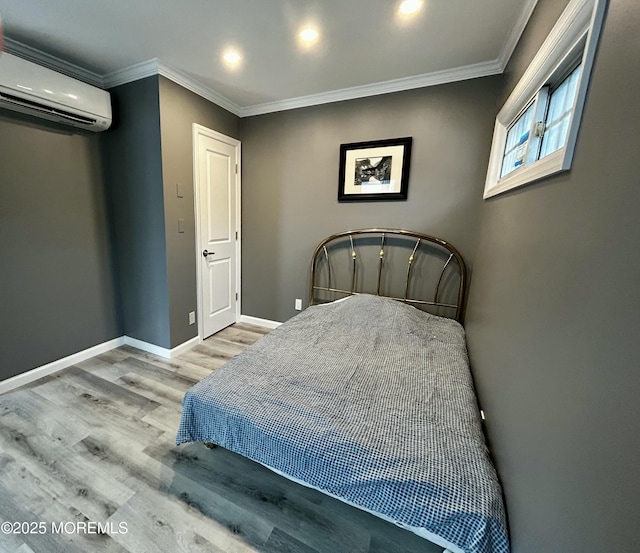 470 Mantoloking Rd, Brick, NJ 08723 - bedroom featuring a wall unit AC, wood finished floors, ornamental molding, baseboards, and recessed lighting