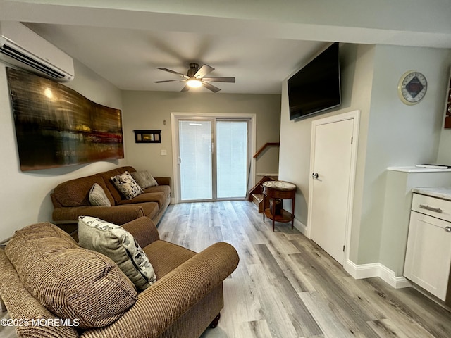 470 Mantoloking Rd, Brick, NJ 08723 - living room featuring an AC wall unit, light wood-style floors, stairway, and ceiling fan