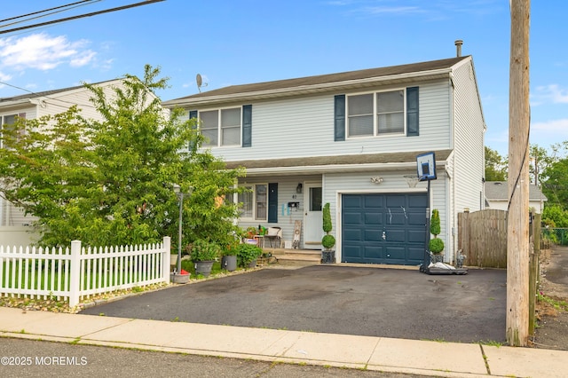 40 Wood St, Keansburg, NJ 07734 - view of front of property with a garage, driveway, and covered porch