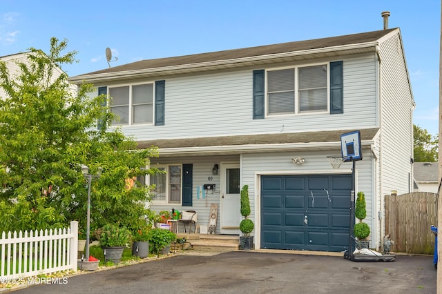 40 Wood St, Keansburg, NJ 07734 - view of front of property with a garage, a porch, and driveway