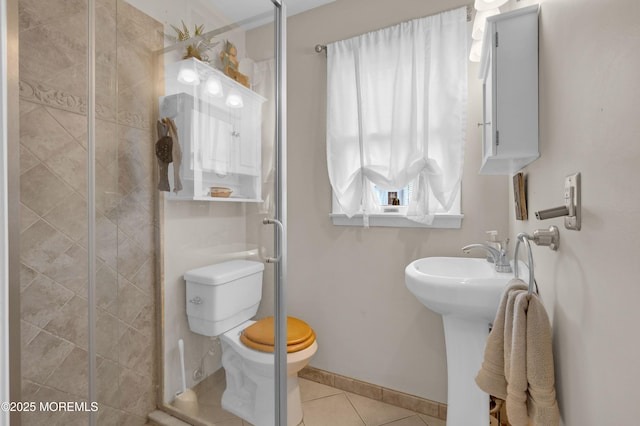 40 Wood St, Keansburg, NJ 07734 - bathroom with tile patterned floors, toilet, a stall shower, and baseboards