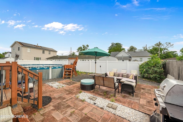 40 Wood St, Keansburg, NJ 07734 - fenced backyard featuring a grill, outdoor lounge area, and a patio