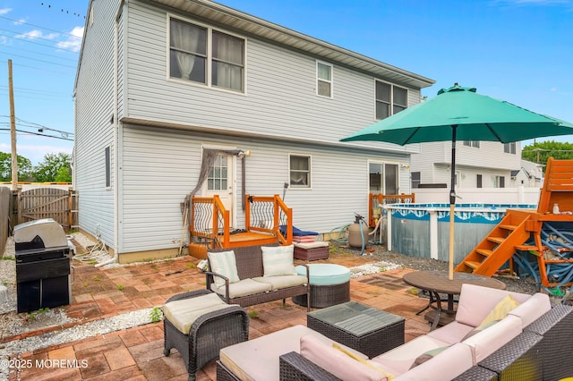 40 Wood St, Keansburg, NJ 07734 - back of house with an outdoor living space, a fenced backyard, and a patio