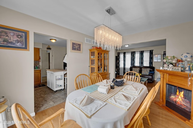 40 Wood St, Keansburg, NJ 07734 - dining room with a chandelier and a glass covered fireplace