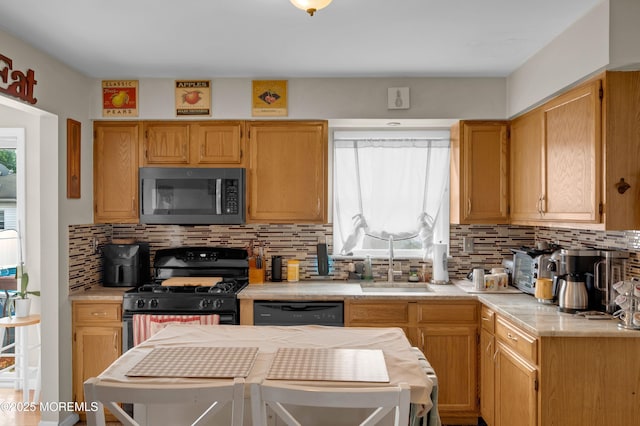 40 Wood St, Keansburg, NJ 07734 - kitchen featuring black appliances, a sink, light countertops, and decorative backsplash