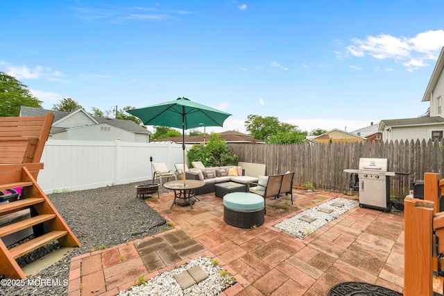 40 Wood St, Keansburg, NJ 07734 - fenced backyard with an outdoor living space with a fire pit, grilling area, and a patio