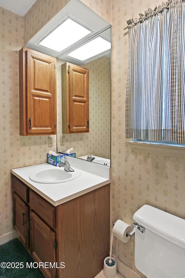612 Petunia Ln S, Whiting, NJ 08759 - bathroom featuring vanity, toilet, and wallpapered walls
