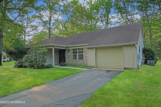 612 Petunia Ln S, Whiting, NJ 08759 - ranch-style house with asphalt driveway, a front lawn, an attached garage, and a shingled roof