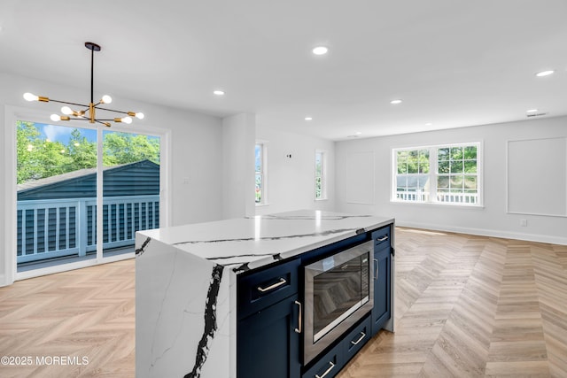 118 Cedar Point Ave, Brick, NJ 08723 - kitchen featuring stainless steel microwave, a chandelier, recessed lighting, light stone counters, and open floor plan