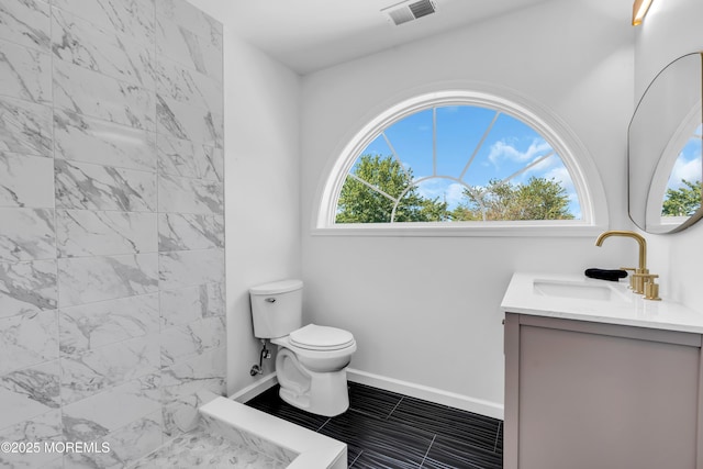 118 Cedar Point Ave, Brick, NJ 08723 - bathroom with vanity, toilet, a tile shower, baseboards, and tile patterned flooring