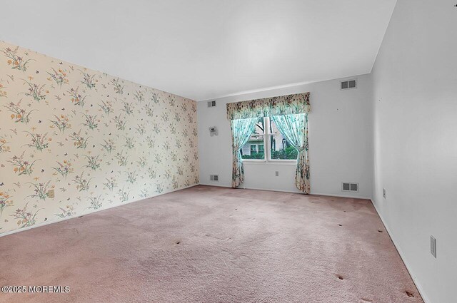 62 Woodshill Dr S, Lakewood, NJ 08701 - carpeted empty room featuring wallpapered walls