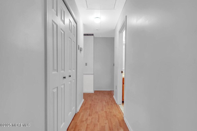 62 Woodshill Dr S, Lakewood, NJ 08701 - corridor featuring attic access, light wood-type flooring, and baseboards