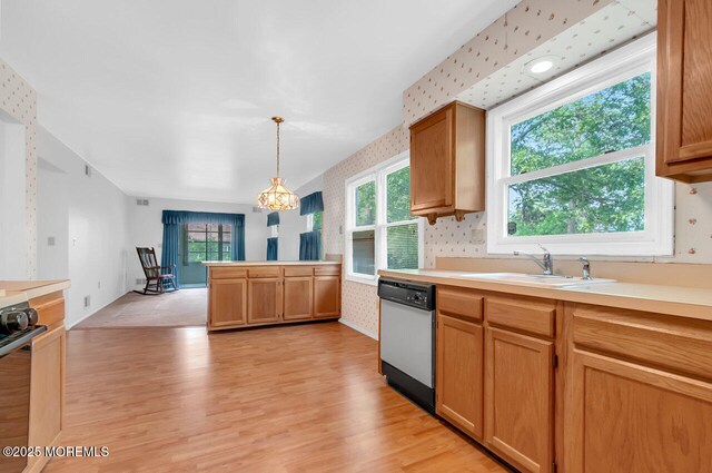 62 Woodshill Dr S, Lakewood, NJ 08701 - kitchen featuring dishwasher, wallpapered walls, a sink, stainless steel range, and light wood-style floors
