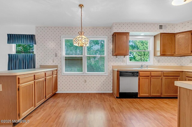 62 Woodshill Dr S, Lakewood, NJ 08701 - kitchen featuring dishwasher, wallpapered walls, light wood finished floors, a sink, and light countertops