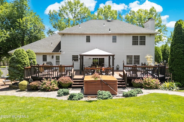 21 Tanglewood Pl, Monroe, NJ 08831 - back of house featuring a chimney, a yard, a deck, and a shingled roof