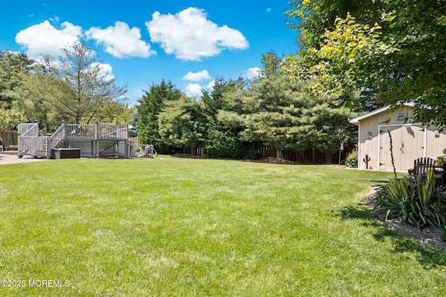 21 Tanglewood Pl, Monroe, NJ 08831 - view of green lawn with stairs and a wooden deck
