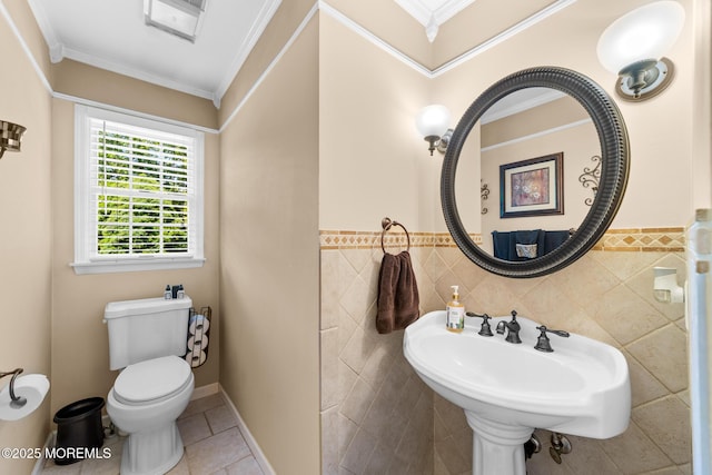 21 Tanglewood Pl, Monroe, NJ 08831 - bathroom with tile walls, toilet, crown molding, tile patterned floors, and a wainscoted wall