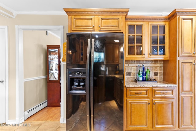 21 Tanglewood Pl, Monroe, NJ 08831 - kitchen with black refrigerator with ice dispenser, a baseboard radiator, light stone counters, crown molding, and backsplash