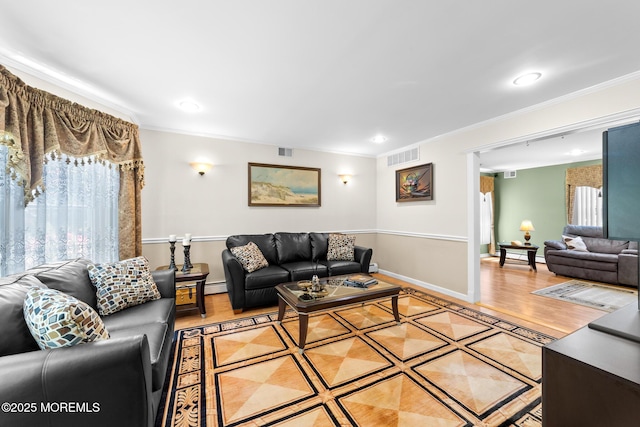 21 Tanglewood Pl, Monroe, NJ 08831 - living area with crown molding, recessed lighting, wood finished floors, baseboard heating, and baseboards