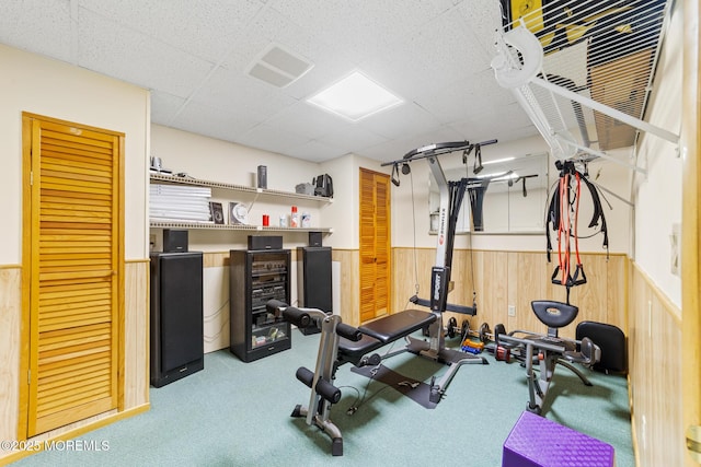 21 Tanglewood Pl, Monroe, NJ 08831 - workout room featuring wainscoting, wood walls, carpet flooring, and a paneled ceiling