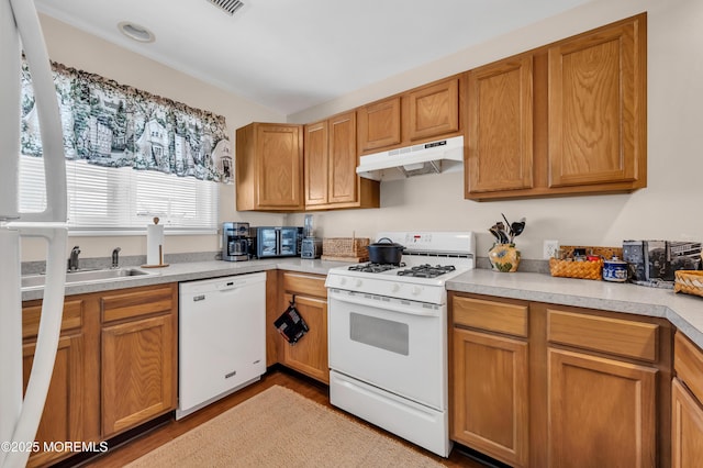 1090 Radio Rd Unit 12, Little Egg Harbor, NJ 08087 - kitchen featuring white appliances, under cabinet range hood, wood finished floors, and light countertops